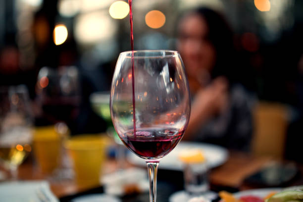 istock red wine on young adults valentines day table 1127435040