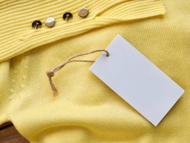 istock Yellow spring sweater and clothing label 1127436539
