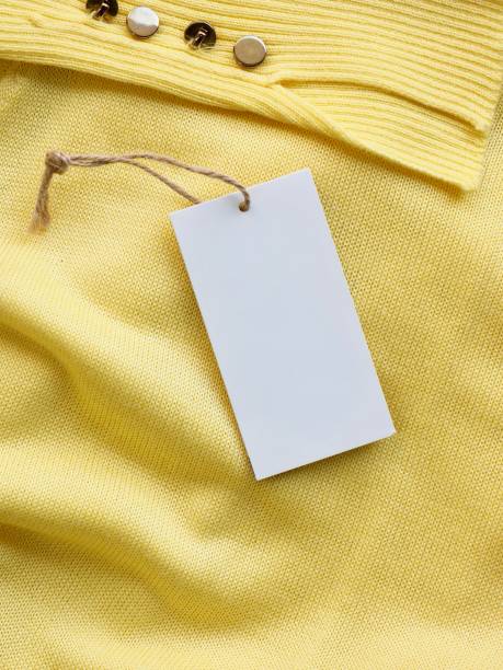 istock Yellow spring sweater and clothing label 1127436540