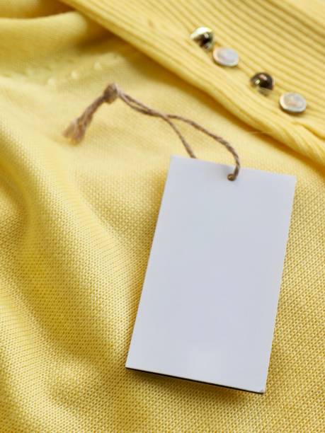 istock Yellow spring sweater and clothing label 1127436553