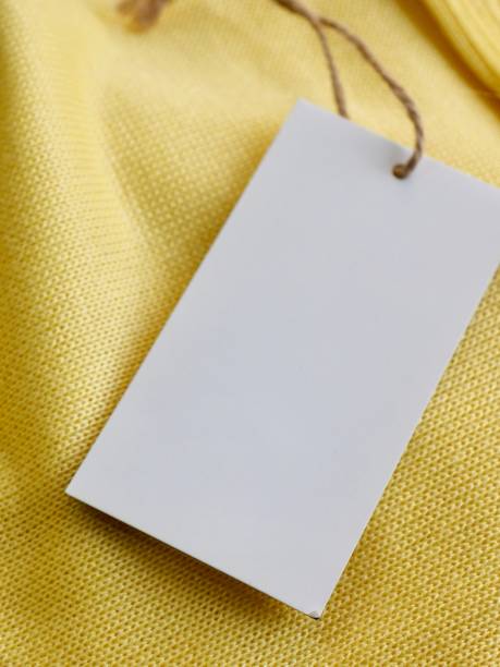 istock Yellow spring sweater and clothing label 1127436554