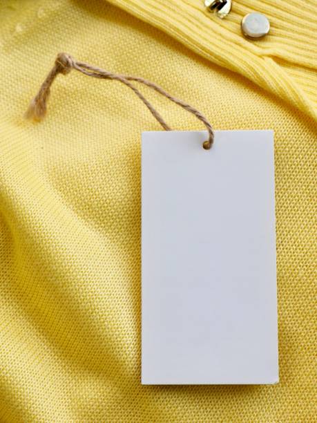 istock Yellow spring sweater and clothing label 1127436555