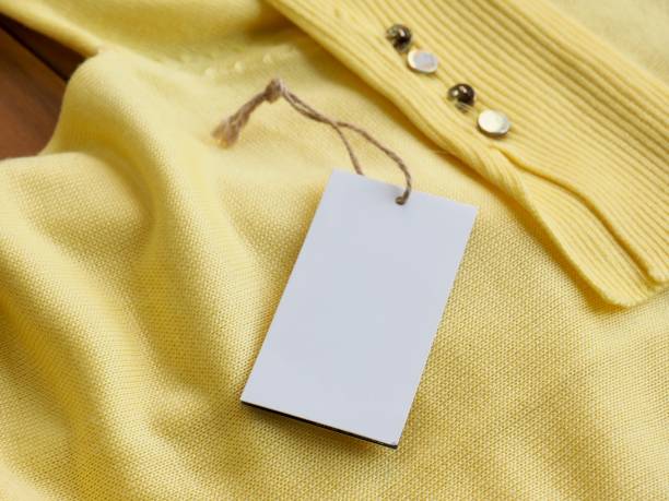 istock Yellow spring sweater and clothing label 1127436557
