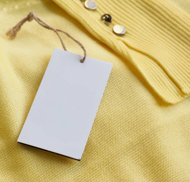 istock Yellow spring sweater and clothing label 1127436559