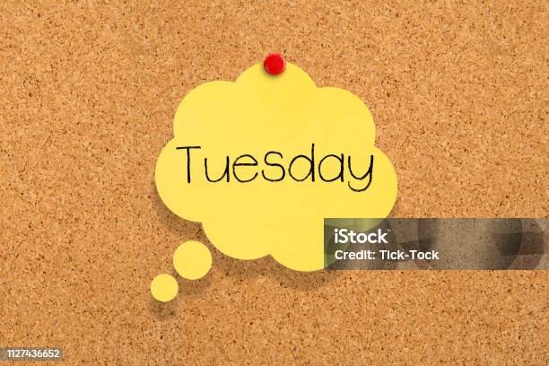 Sticky Note Pinned On Bulletin Board Tuesday Stock Photo - Download Image Now - Tuesday, Advice, Happiness