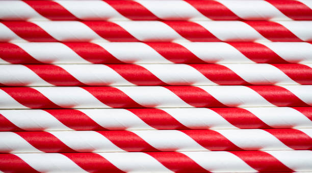 istock Close up paper striped colorful straws background 1127444234