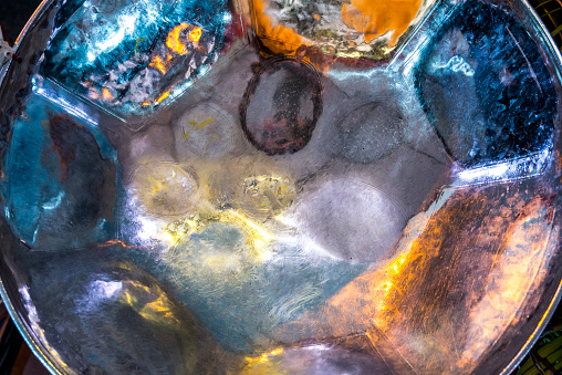 close-up of a colorful soca pan drum. Steel drum percussion harmonics for carnival period.
