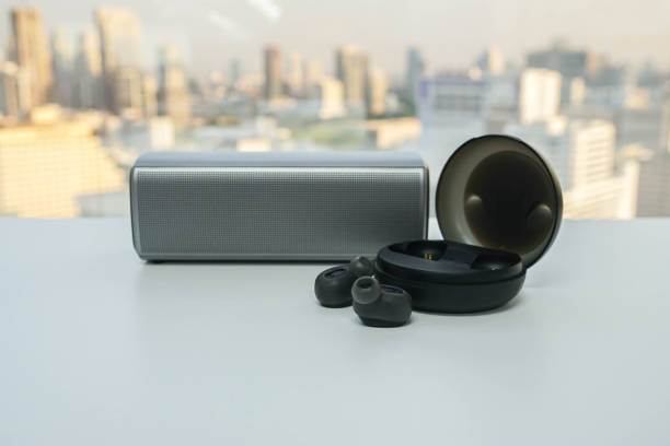 istock isolated portable bluetooth speaker and wireless earphone with trendy case for music 1127448551