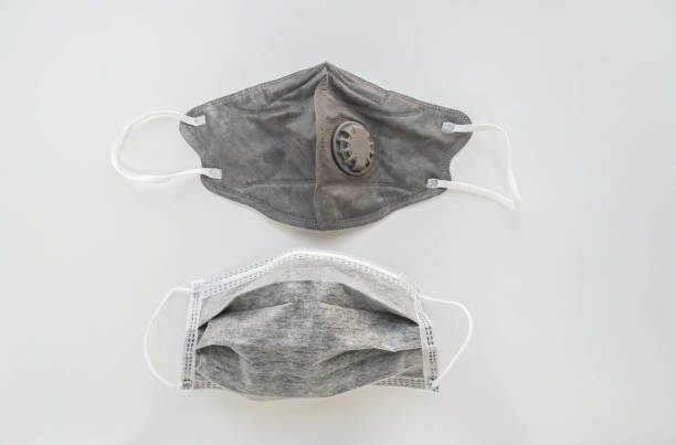 istock isolated carbon mask and face mask with valve for prevention PM 2.5 pollution 1127448553