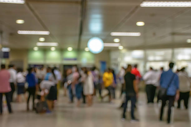 istock Blurry image of passengers stand waiting for the train. 1127449239