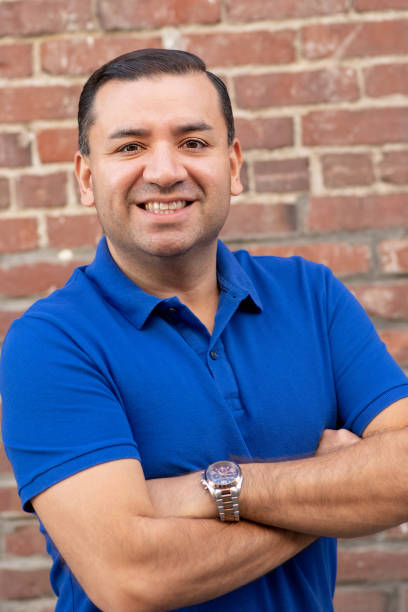 istock Smiling hispanic mid adult man 1127450358