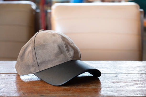 istock Sports cap on the old wooden table 1127452043