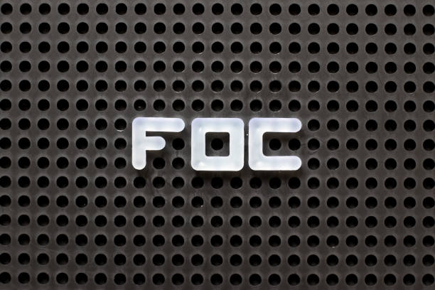istock Black color pegboard with white letter in word FOC (Abbreviation of Free of charge) 1127452106