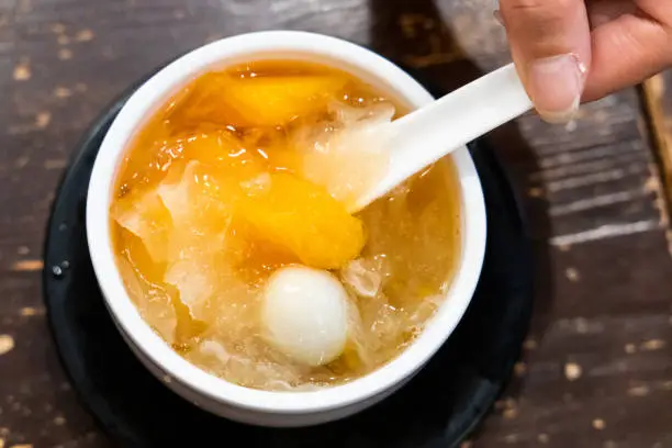 Photo of Papaya with snow fungus and egg sweet dessert soup