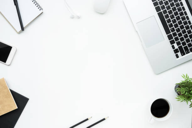 istock White office desk table with a lot of things on it. Top view with copy space, flat lay. 1127454123