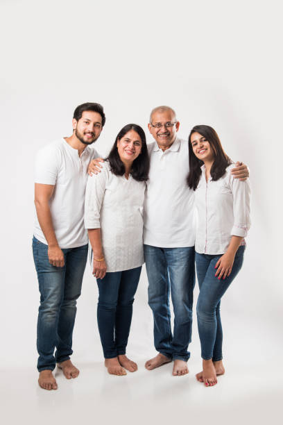 istock happy Indian family standing isolated over white background 1127455530