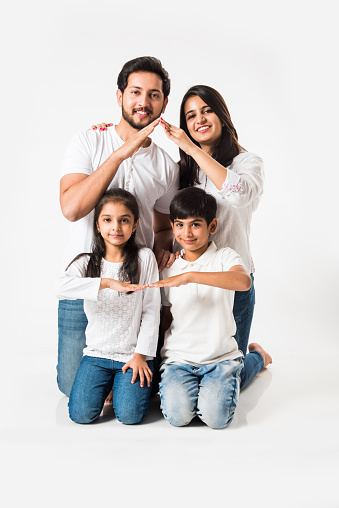 Indian family making the home sign over white background. selective focus