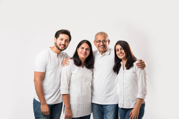 istock happy Indian family standing isolated over white background 1127456809