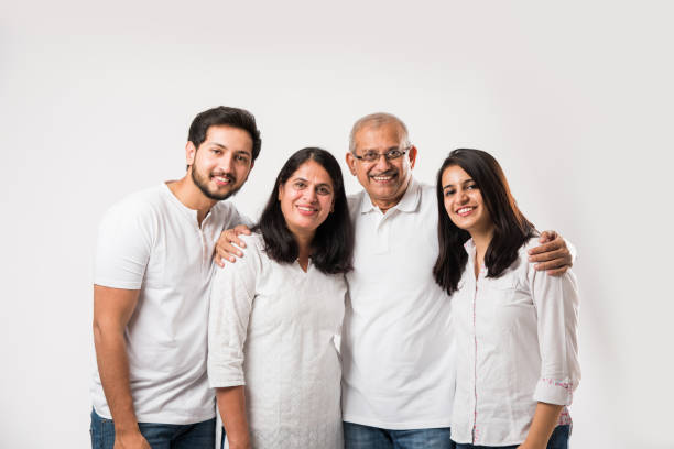 istock happy Indian family standing isolated over white background 1127457641