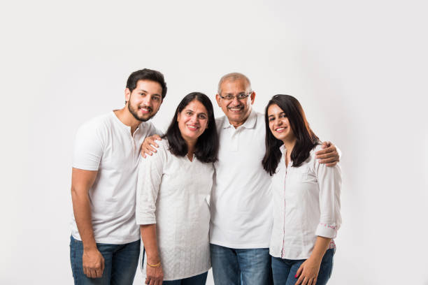 istock happy Indian family standing isolated over white background 1127457655