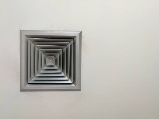 4 way supply ceiling air diffuser, Air louver ceiling diffuser - Supply air diffuser in office room and copy space 4 way supply ceiling air diffuser, Air louver ceiling diffuser - Supply air diffuser in office room and copy space modern office ceiling air conditioning system stock pictures, royalty-free photos & images