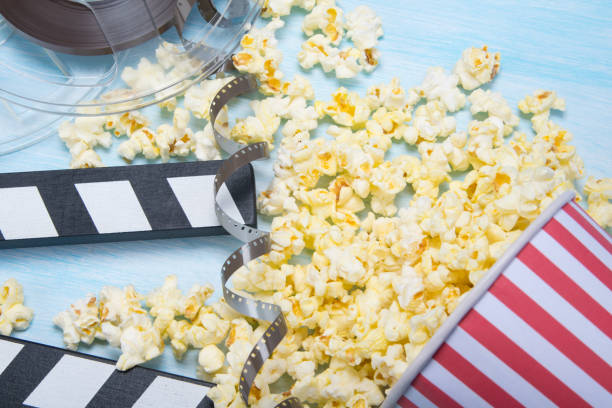 istock on a blue background, scattered a bucket of popcorn, next is a double for filming 1127464603