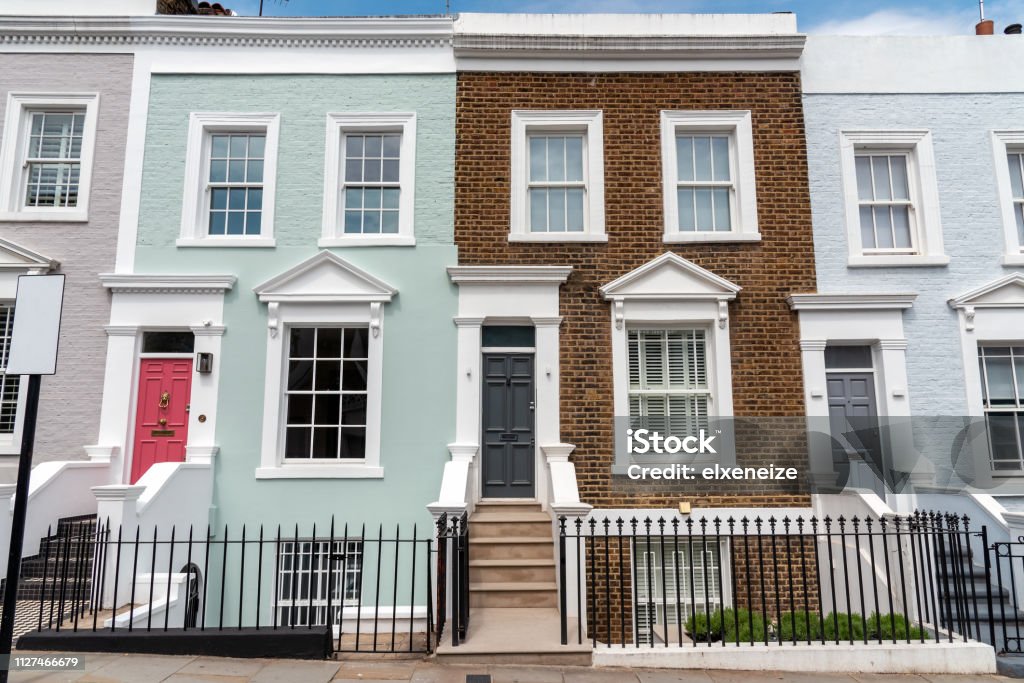 Colored row houses Colored row houses seen in Notting Hill, London House Stock Photo