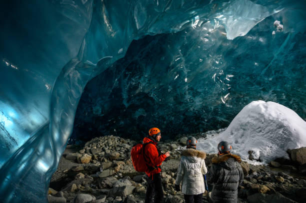 istock Guided tour in a majestic ice cave 1127468509