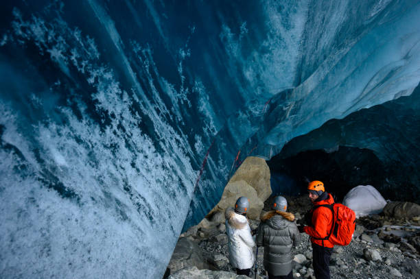 istock Guided tour in a majestic ice cave 1127468510