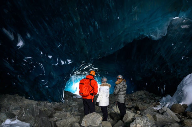 istock Guided tour in a majestic ice cave 1127468513