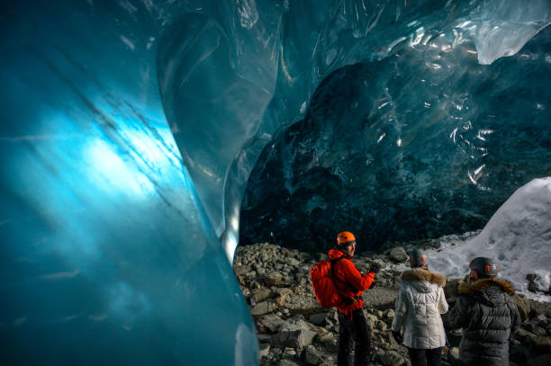 istock Guided tour in a majestic ice cave 1127468515