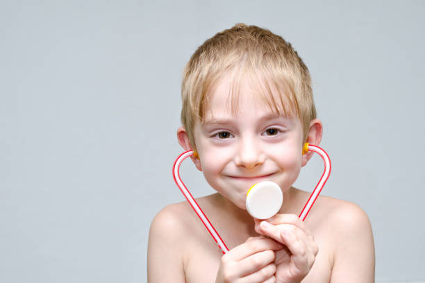 istock Cute boy with toy phonendoscope playing doctor. Portrait 1127469349