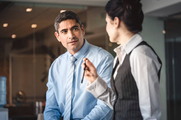 istock Businessman discussing with coworker in office 1127471221