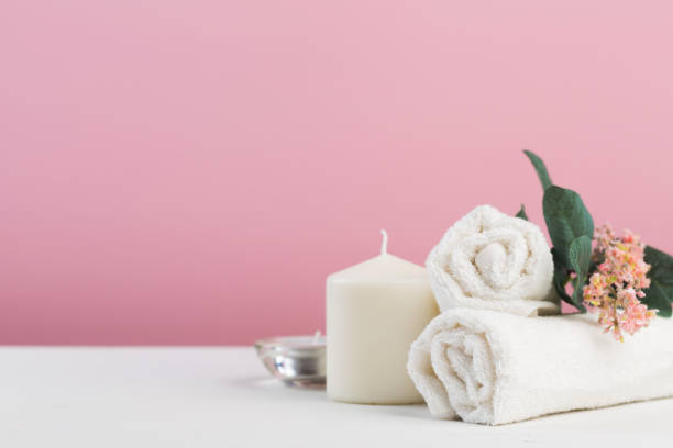 istock Spa still life with aromatic candles, flower and towel. - Image 1127472492