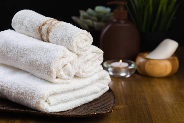 istock Spa still life with aromatic candles, flower and towel. - Image 1127472496