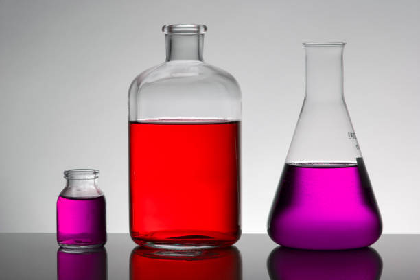 istock Liquid in laboratory bottles. Scientific biochemical laboratory. Colorful liquid. Isolated on white background,  a group of bottles. Test tubes. 1127472793