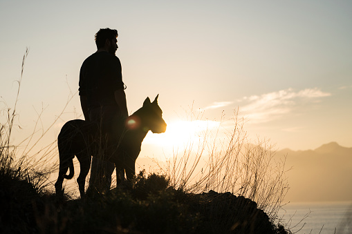 Man with his dog at sunset, Antalya Turkey