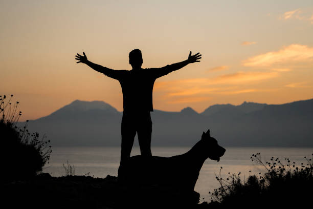 Man with his dog at sunset, Antalya Turkey