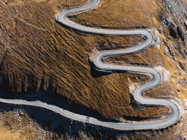 istock spiral road on top of mountain 1127474826
