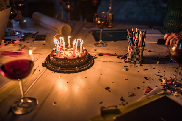 Birthday candles on a slice of chocolate cake.  Shallow DOF.