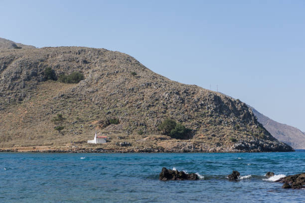Coastal view with ruined buildings near Tavsanbuku Adasi island off the Bozburun Peninsula in Marmaris, Mugla, Turkey.