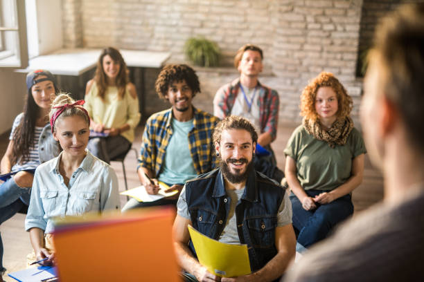 istock Happy freelance workers attending a training class in the office. 1127476523
