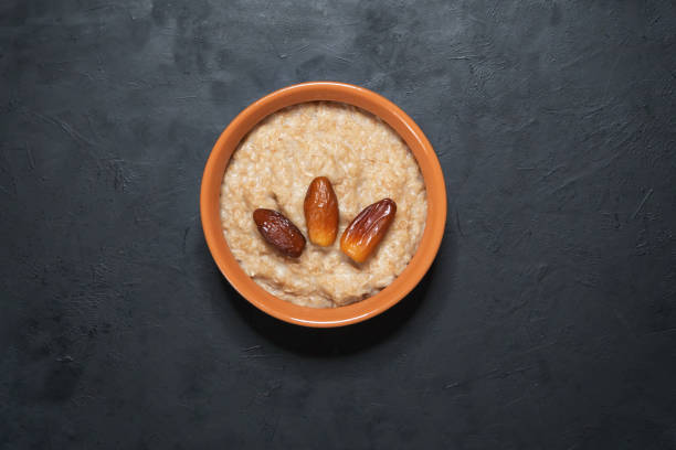 istock Healthy eating. Oatmeal porridge with dates. 1127479976
