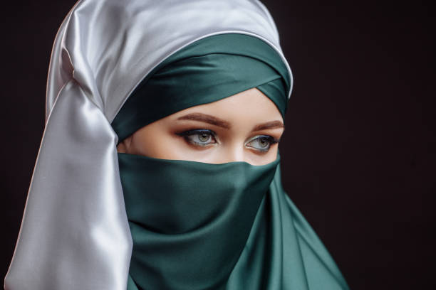 istock close up side view shot. a pretty lady is dressed in green hijab 1127480109