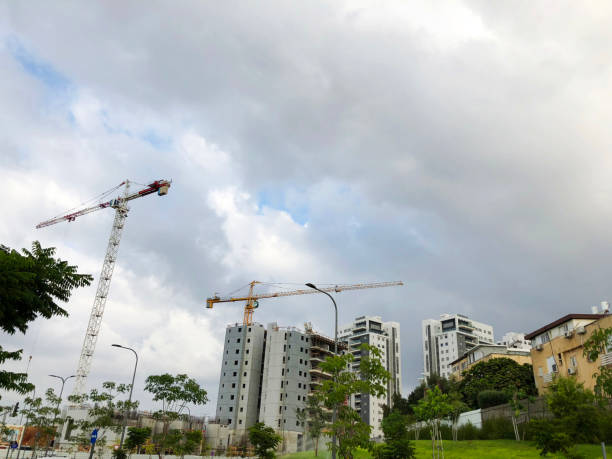 istock Industrial construction cranes and construction of houses 1127481555