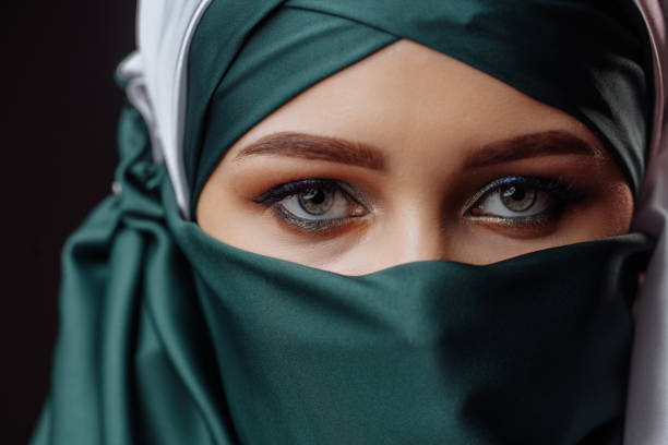 istock Muslim girl with hided face 1127481622