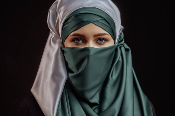 istock inner beauty. pleasant pilgrim in satin green and white hijab 1127481725