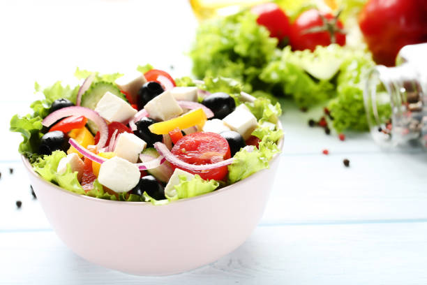 istock Vegetable salad in bowl on wooden table 1127485776