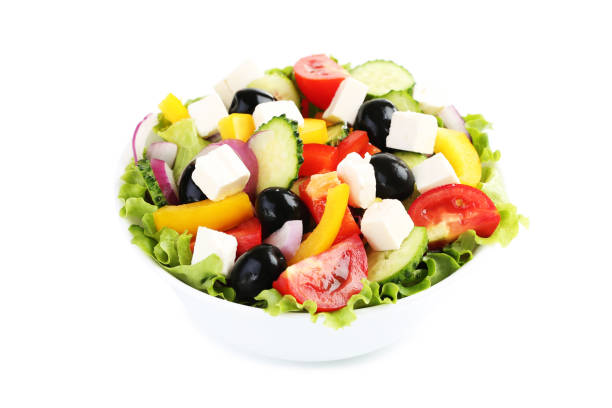 istock Vegetable salad in bowl isolated on white background 1127485843