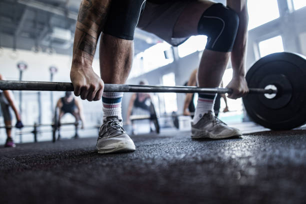 istock Unrecognizable male athlete exercising deadlift on cross training. 1127486220